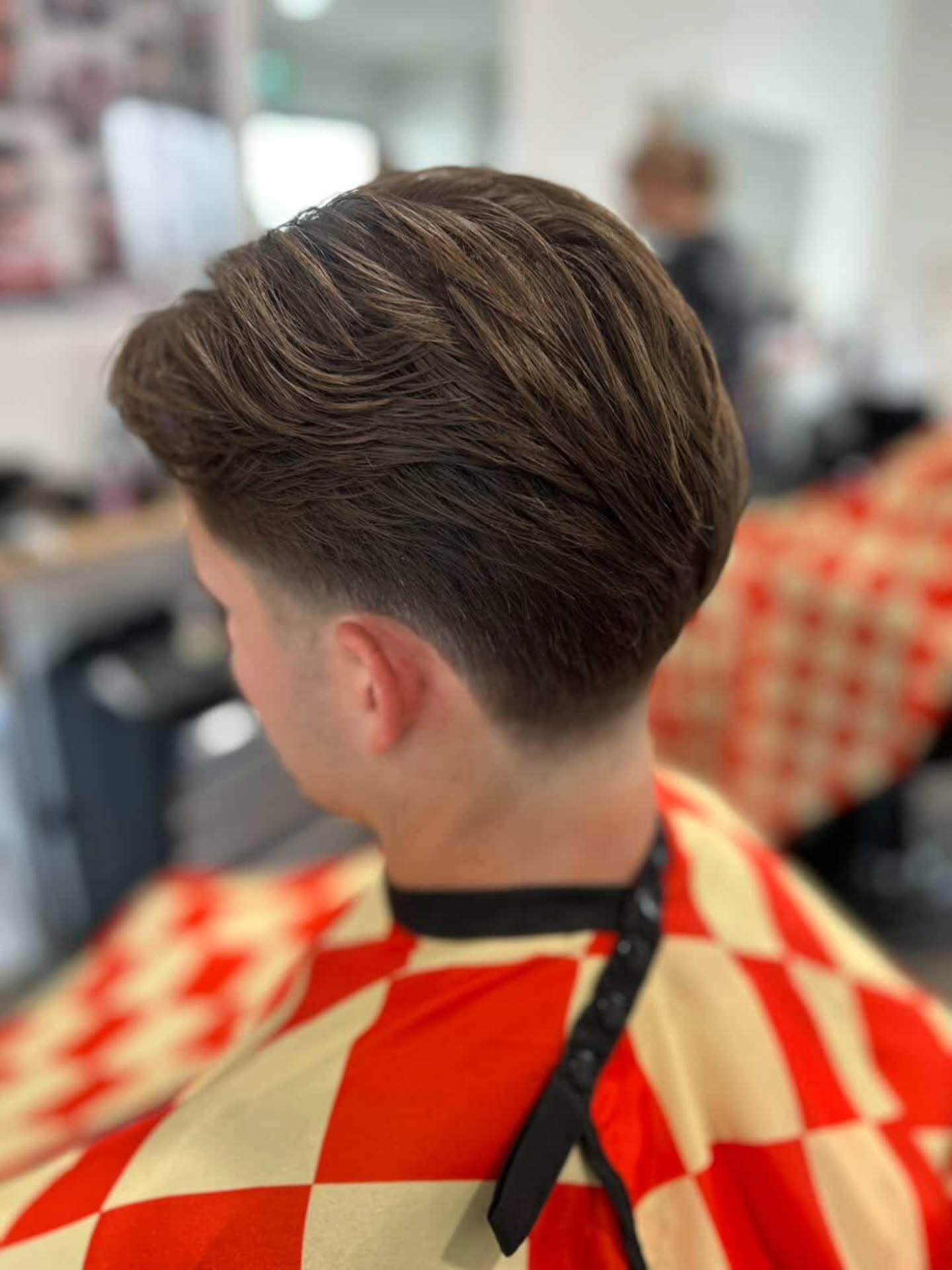 Pompadour with a fade, side view